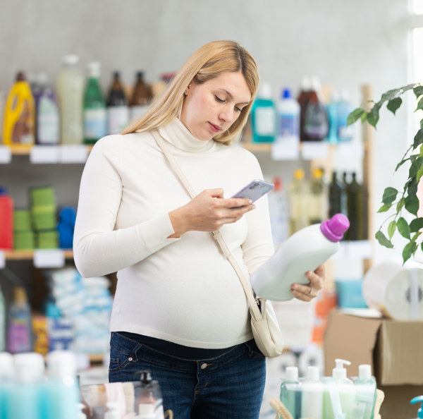 Shopper unpacking vetted household products in her kitchen